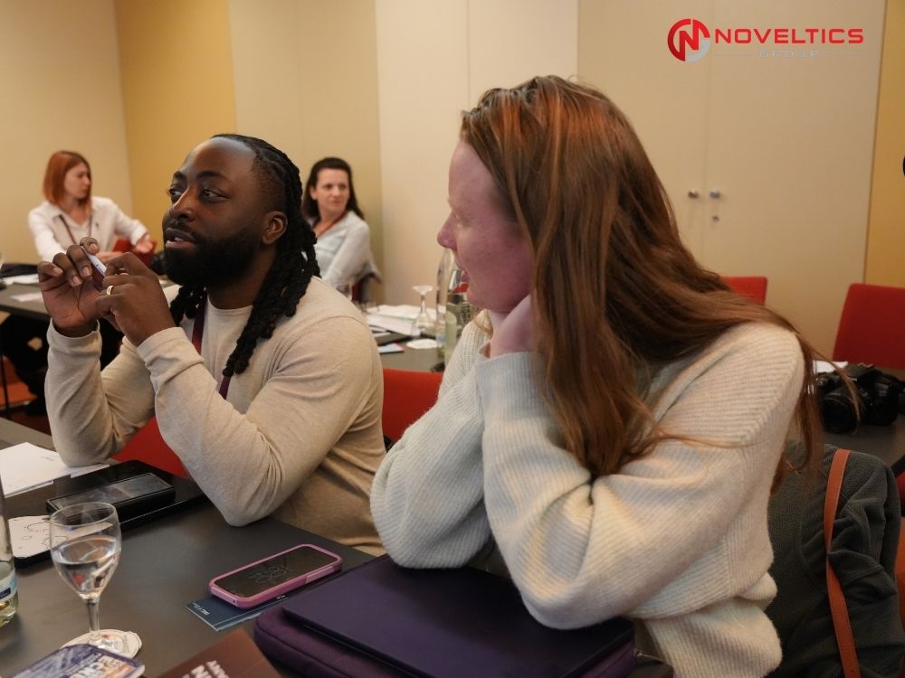 Researcher asking question during panel discussion at Autism Summit Germany 2026