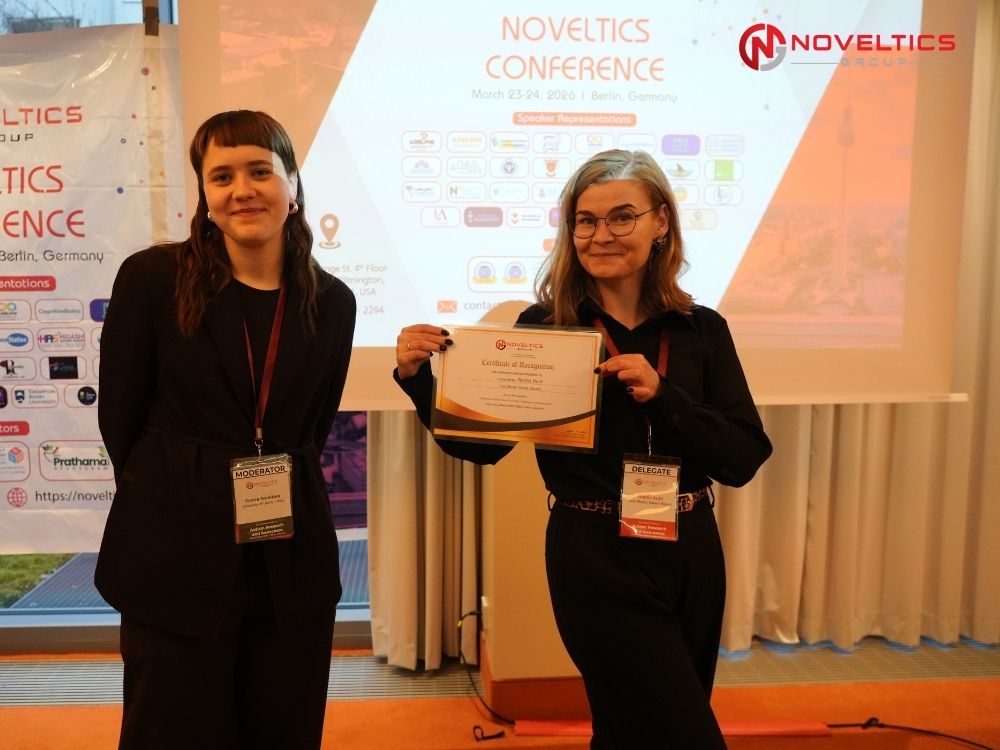 Certificate handover to participant at Autism Research 2026 Germany Noveltics